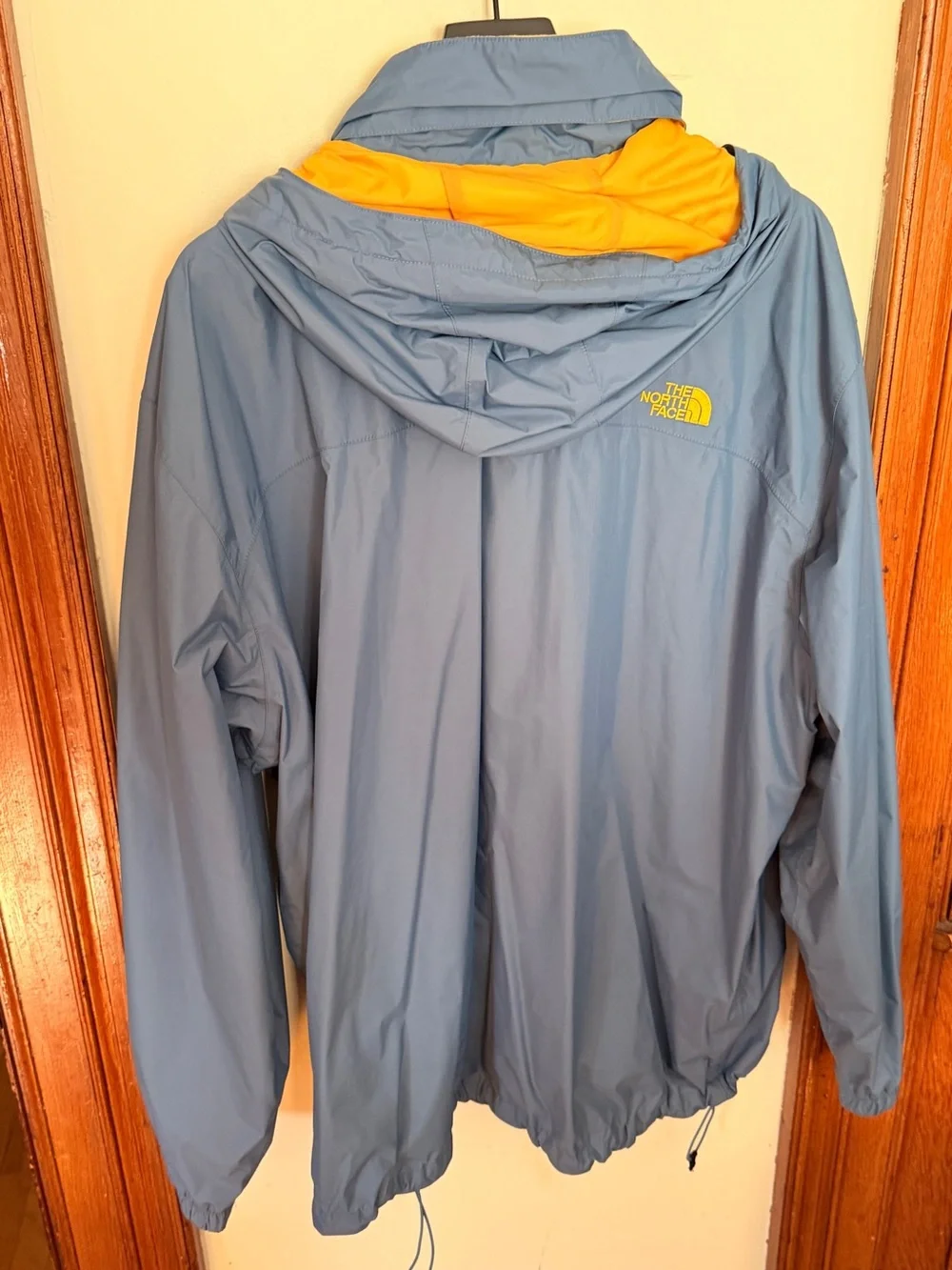 The North Face Men's Blue Rain Jacket with Yellow Hood Lining